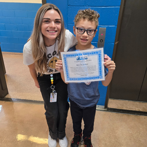 Malcolm Rockett, Pfeiffer-Burliegh's Stairclimber for October, poses with his award plaque.